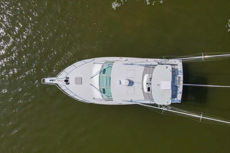 Slide: The Image of Aerial view of 1995 Cabo 35 Express boat on calm water. - 69