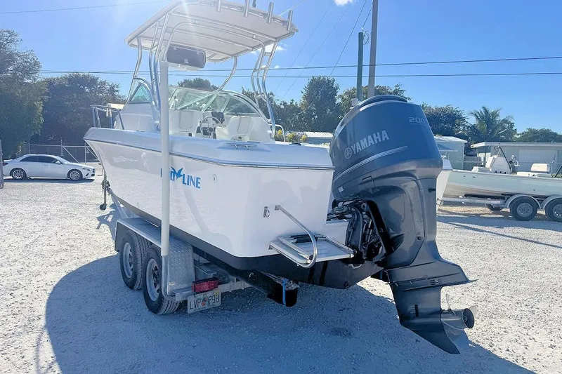 Slide: The Image of 2000 Pro-Line 22 Walkaround boat with Yamaha outboard motor on trailer. - 3