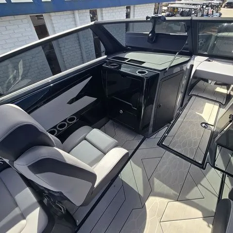 Slide: The Image of Interior of 2025 Yamaha Boats 222XE with modern seating and features. - 10