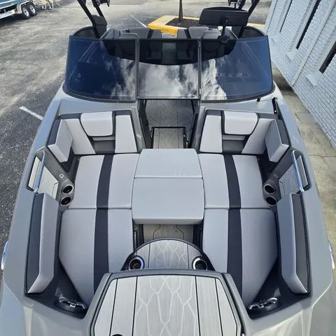 Slide: The Image of Interior view of 2025 Yamaha Boats 222XE with gray upholstery. - 16