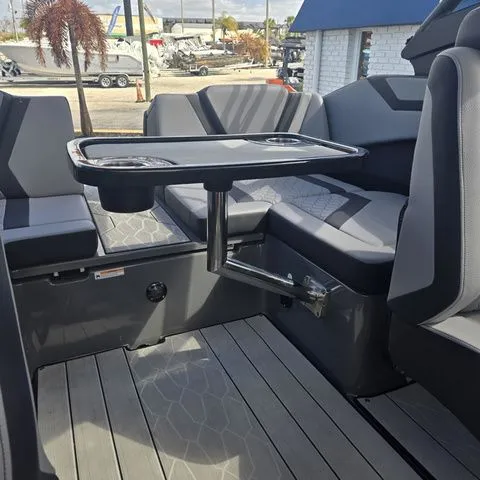 Slide: The Image of Interior of 2025 Yamaha Boats 222XE with table and seating area. - 19