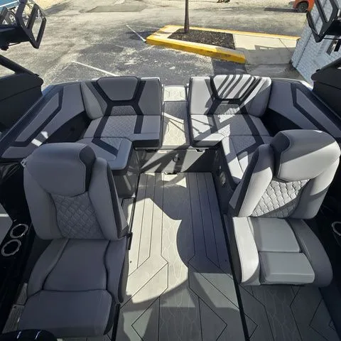 Slide: The Image of Interior of 2025 Yamaha Boats 222XE with luxurious gray seating. - 9