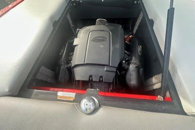 Slide: The Image of 2011 Supra Launch 242 engine compartment with Indmar engine visible. - 10