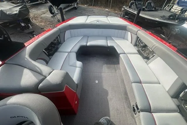 Slide: The Image of 2011 Supra Launch 242 boat interior with spacious seating and modern design. - 13