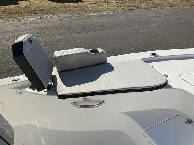 Slide: The Image of 2026 Sea Pro 230 Bay Boat seating area with cup holder. - 17