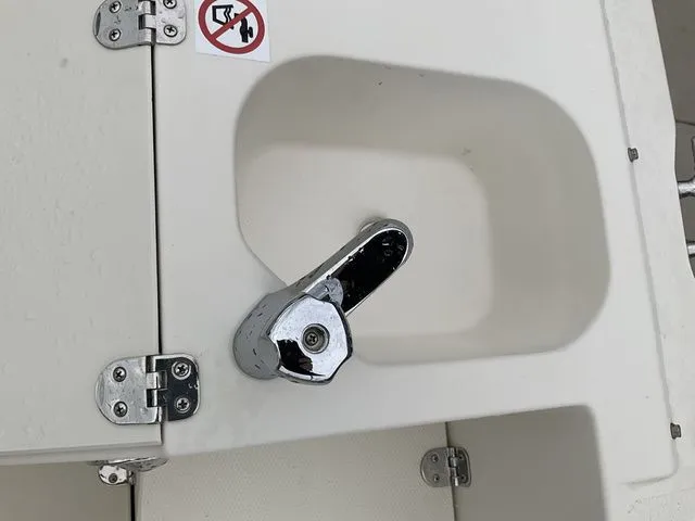 Slide: The Image of Stingray 212 boat 2022, sink with faucet and warning symbol. - 14