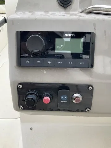 Slide: The Image of Stingray 212 boat console with Fusion stereo system, year 2022. - 17