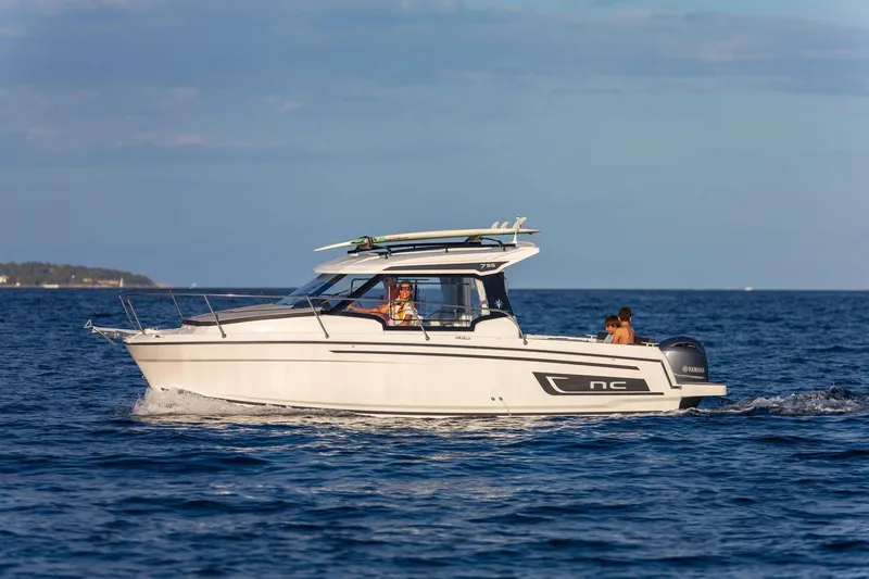 The Image of 2026 Jeanneau NC 795 Series 2 cruising on open water under clear skies. - 1