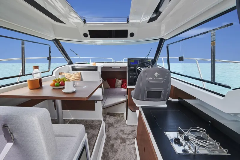Slide: The Image of Interior of 2026 Jeanneau NC 795 Series 2 boat with modern amenities and ocean view. - 13