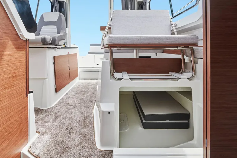 Slide: The Image of 2026 Jeanneau NC 795 Series 2 interior with seating and storage. - 19
