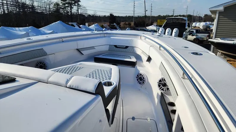 Slide: The Image of 2025 Blackfin 400 CC boat interior with white seating and modern design. - 22