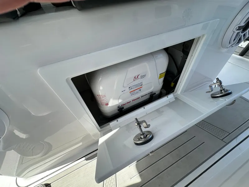 Slide: The Image of 2025 Blackfin 400 CC boat storage compartment with equipment inside. - 6