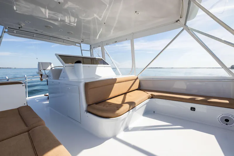 Slide: The Image of Spacious deck of 1996 Jim Smith 60 Sportfish yacht with comfortable seating. - 15