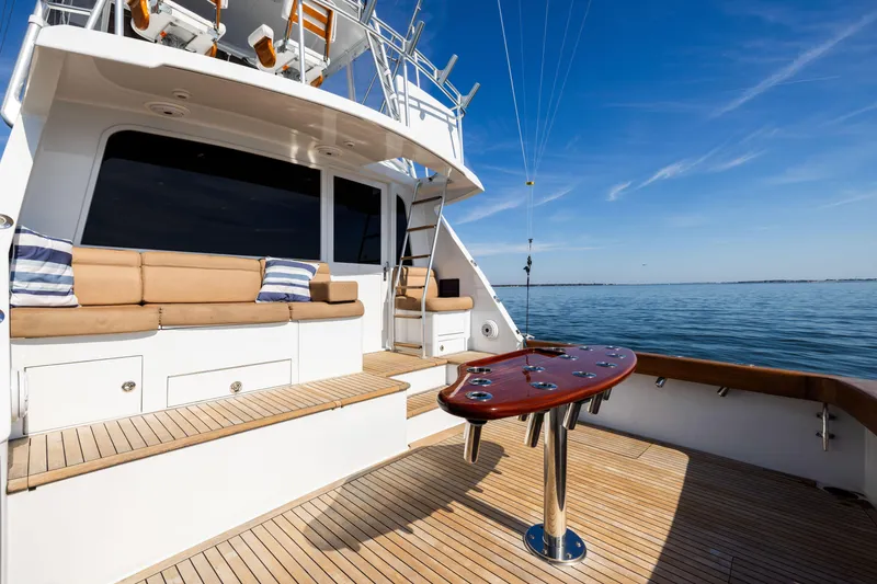 Slide: The Image of Luxurious 1996 Jim Smith 60 Sportfish yacht with spacious deck and seating area. - 18