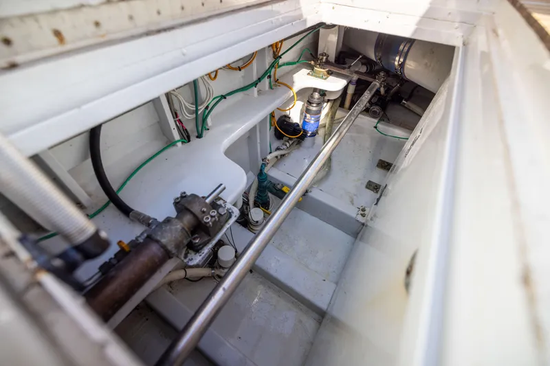 Slide: The Image of Engine compartment of 1996 Jim Smith 60 Sportfish boat, showcasing mechanical components. - 25