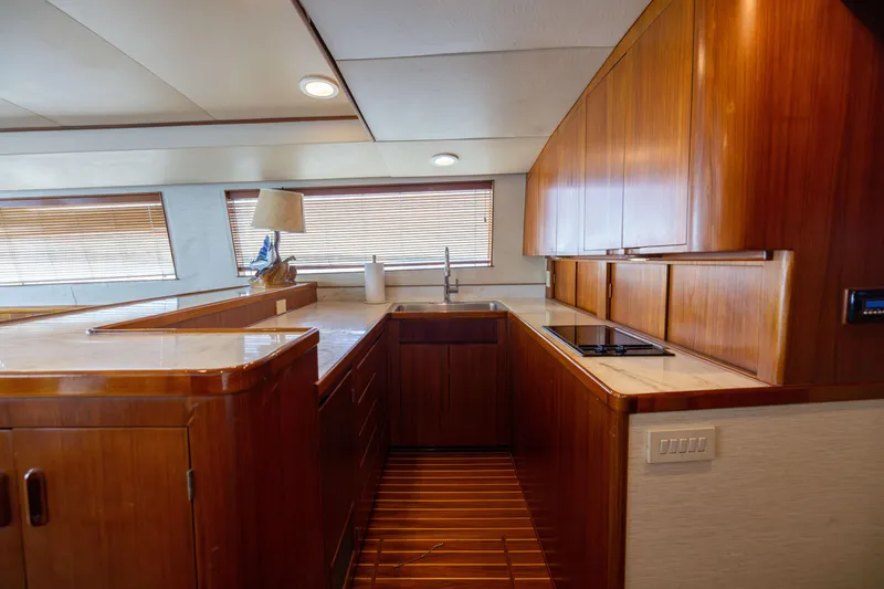Slide: The Image of Luxurious wooden kitchen interior on 1996 Jim Smith 60 Sportfish yacht. - 28