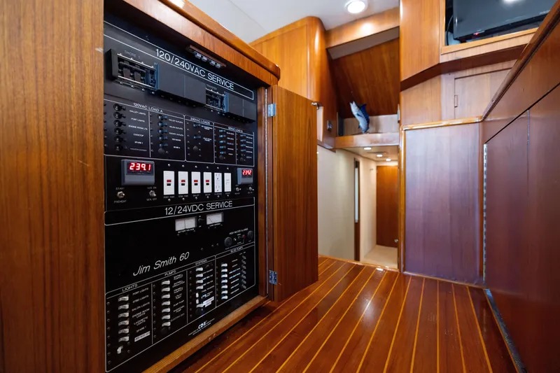 Slide: The Image of Electrical panel inside 1996 Jim Smith 60 Sportfish yacht with wooden interior. - 31