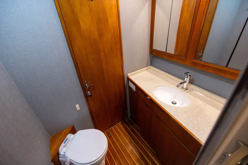 Slide: The Image of Bathroom interior of 1996 Jim Smith 60 Sportfish yacht with wooden cabinetry and modern fixtures. - 37