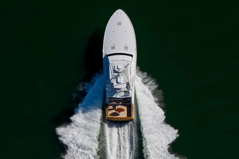 Slide: The Image of Aerial view of 1996 Jim Smith 60 Sportfish yacht cruising on open water. - 4