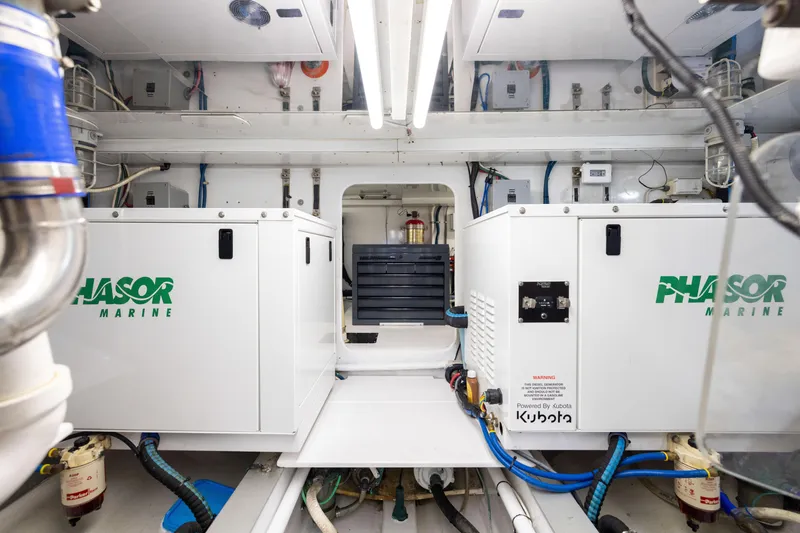 Slide: The Image of Engine room of 1996 Jim Smith 60 Sportfish with Phasor Marine generators. - 45