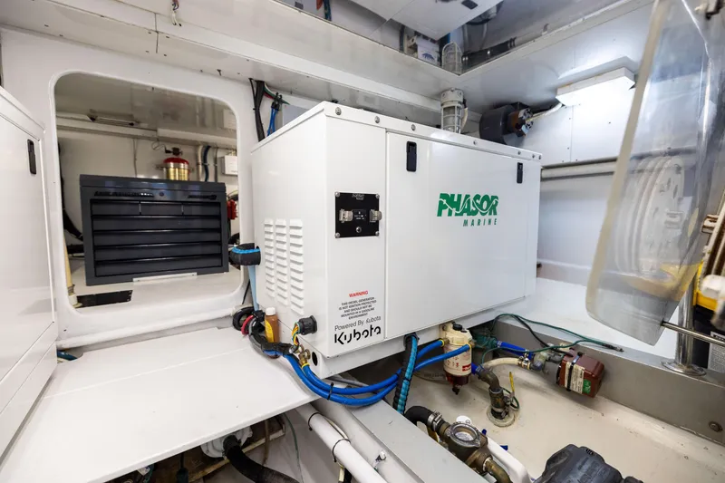 Slide: The Image of Engine room of 1996 Jim Smith 60 Sportfish with Phasor Marine generator. - 47