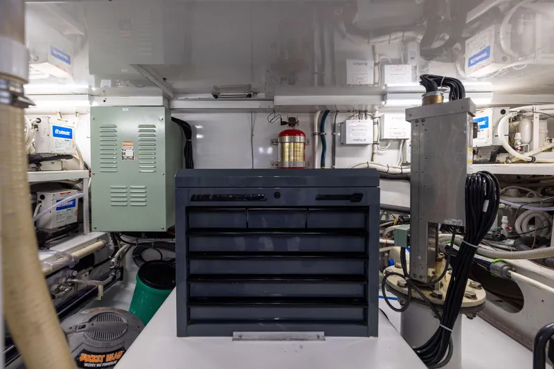 Slide: The Image of Engine room of 1996 Jim Smith 60 Sportfish with tool chest and equipment. - 48