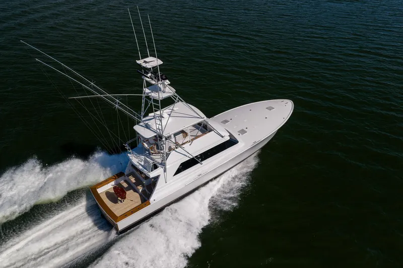 Slide: The Image of Aerial view of 1996 Jim Smith 60 Sportfish yacht cruising on open water. - 6
