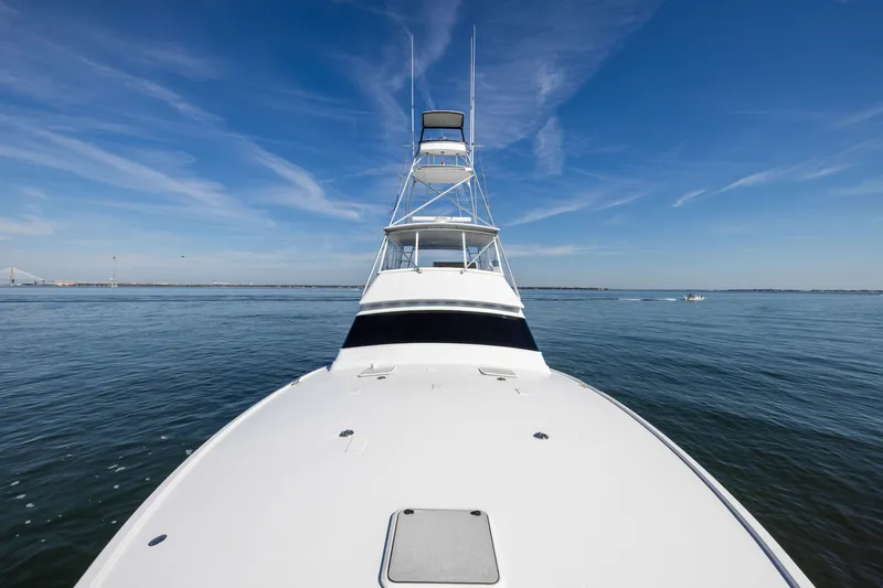 Slide: The Image of 1996 Jim Smith 60 Sportfish yacht on calm ocean under clear blue sky. - 8