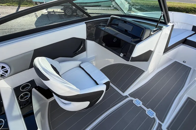 Slide: The Image of Interior of 2026 Monterey M-225 boat with sleek seating and modern dashboard design. - 10