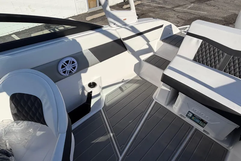 Slide: The Image of 2026 Monterey M-225 boat interior with sleek seating and modern design elements. - 13