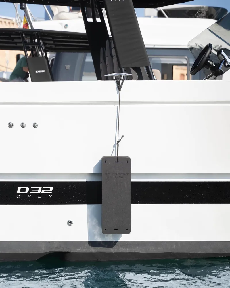 Slide: The Image of 2024 De Antonio Yachts D32 OPEN, sleek design, docked on water. - 1