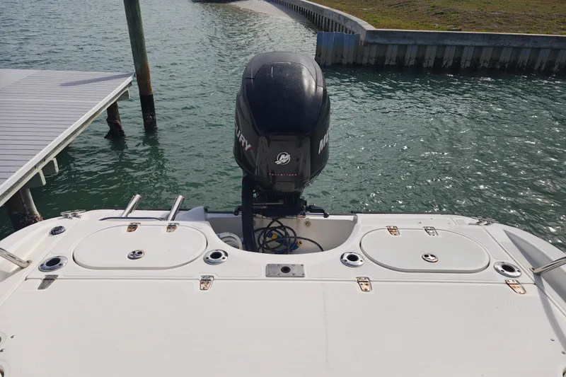 Slide: The Image of 2006 Boston Whaler 180 Dauntless boat with Mercury outboard motor on water. - 14