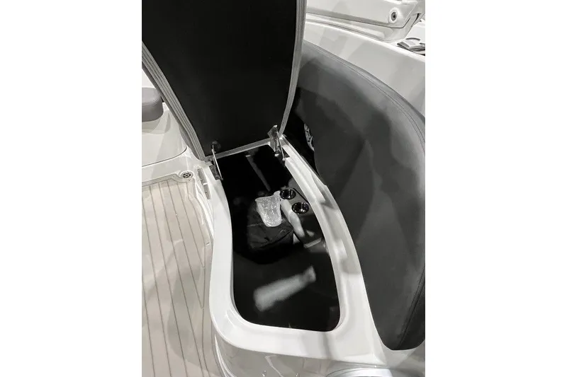Slide: The Image of Open storage compartment in 2026 Crownline 298 SS boat, showcasing interior space. - 8