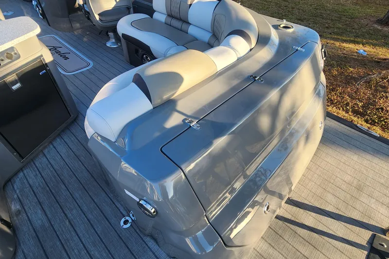 Slide: The Image of 2023 Avalon Excalibur 25' boat interior with luxurious seating and sleek design. - 10