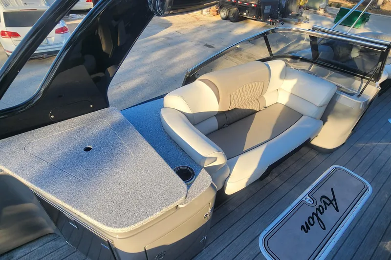 Slide: The Image of Luxurious interior of 2023 Avalon Excalibur 25' boat with plush seating and sleek design. - 14
