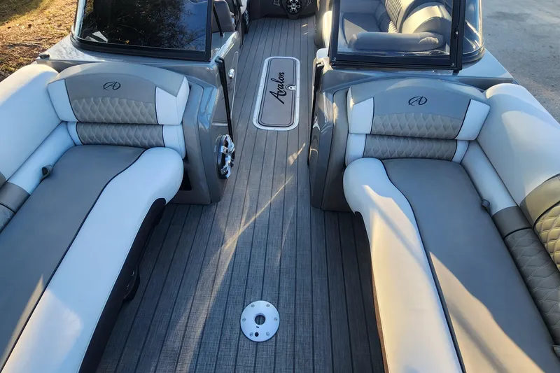 Slide: The Image of Luxurious interior of 2023 Avalon Excalibur 25' boat with elegant seating and flooring. - 16
