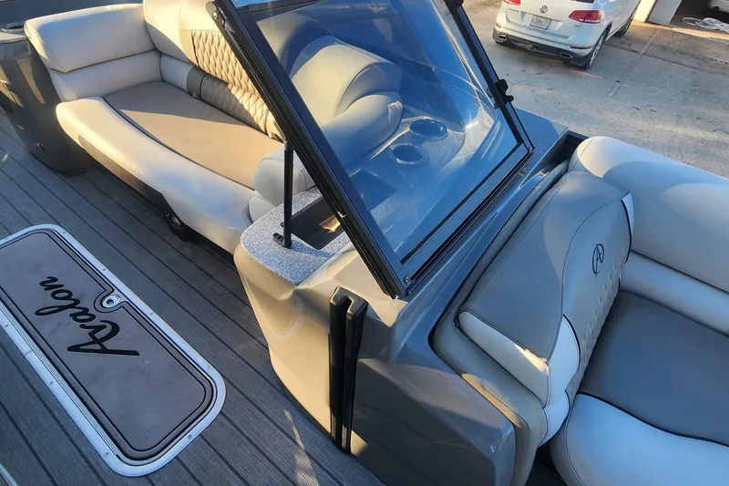 Slide: The Image of 2023 Avalon Excalibur 25' boat interior with luxurious seating and sleek design. - 20