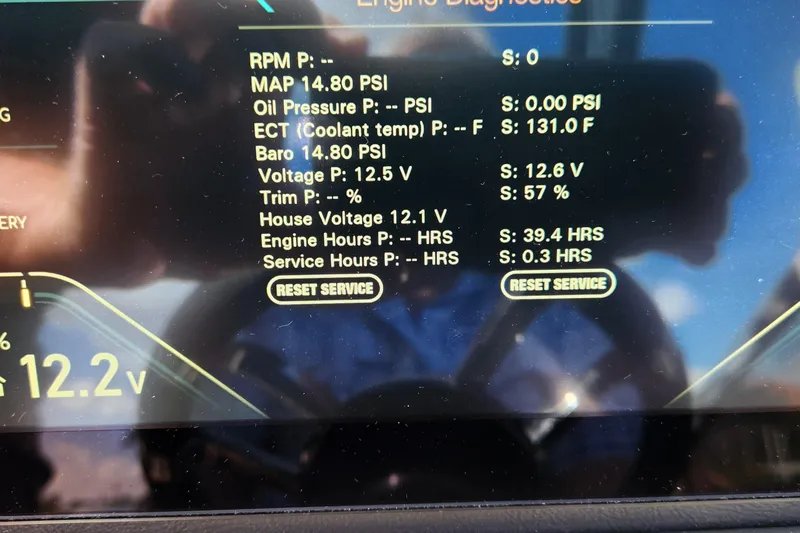Slide: The Image of 2023 Avalon Excalibur engine diagnostics display with various performance metrics and reset service option. - 27