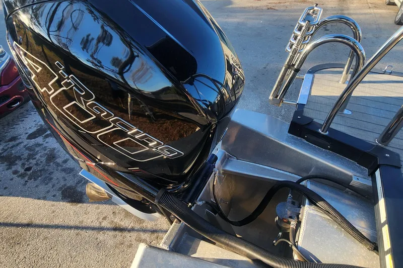 Slide: The Image of 2023 Avalon Excalibur 25' boat with powerful 400 horsepower engine, docked and ready. - 8