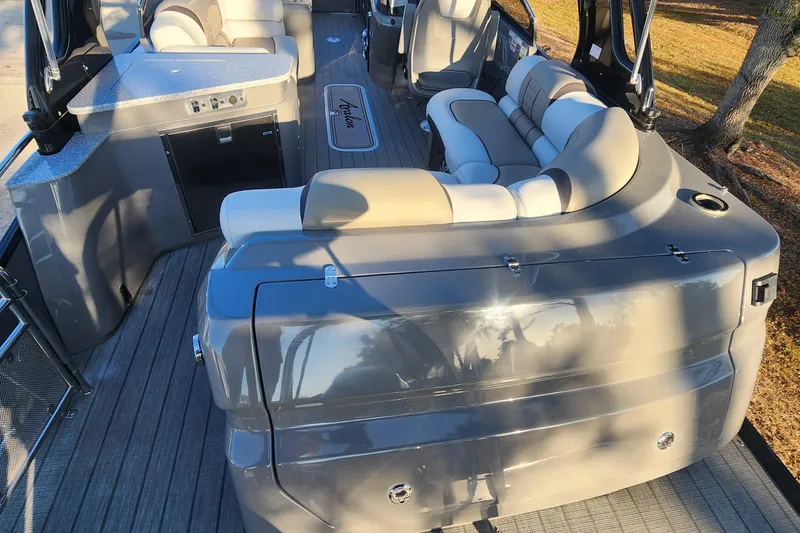 Slide: The Image of 2023 Avalon Excalibur 25' boat interior with luxurious seating and modern amenities. - 9