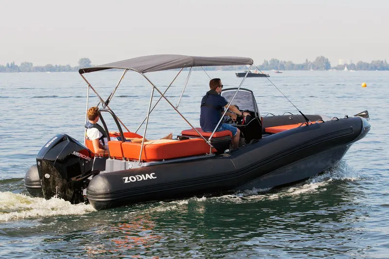 Slide: The Image of 2023 Zodiac N-ZO 680 boat on water with two people. - 13