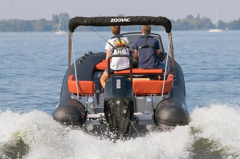 Slide: The Image of Zodiac N-ZO 680 boat, 2023, on water with two people. - 14