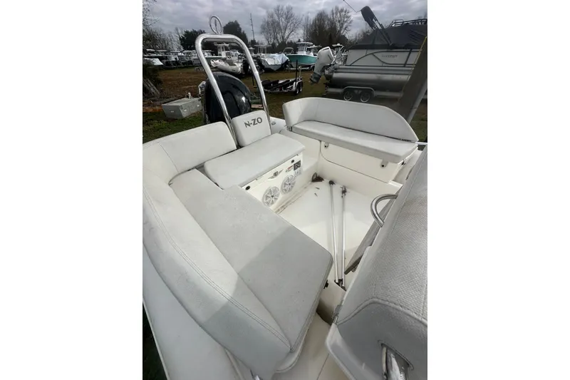 Slide: The Image of 2023 Zodiac N-ZO 680 boat interior with cushioned seating and storage compartments. - 6