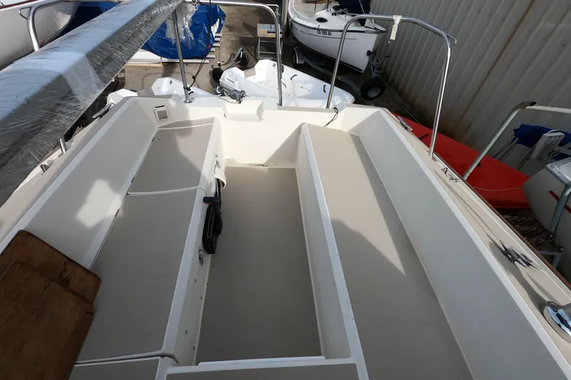 Slide: The Image of 1985 Oday 272 sailboat cockpit with clean, spacious seating and storage areas. - 10