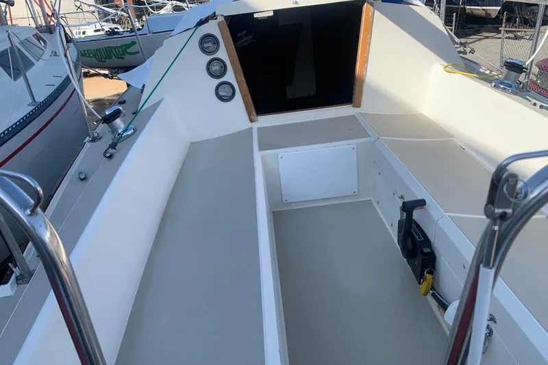 Slide: The Image of 1985 Oday 272 sailboat cockpit with clean seating and control panel. - 26