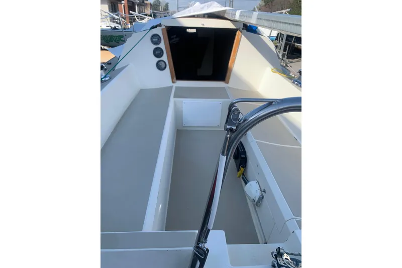 Slide: The Image of 1985 Oday 272 sailboat cockpit with steering wheel and seating area. - 29