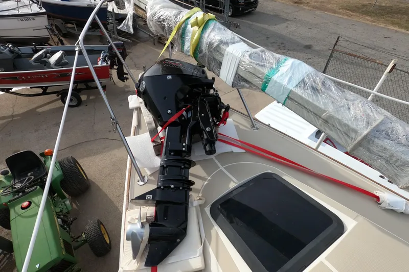 Slide: The Image of 1985 Oday 272 sailboat with outboard motor and wrapped mast on deck. - 9