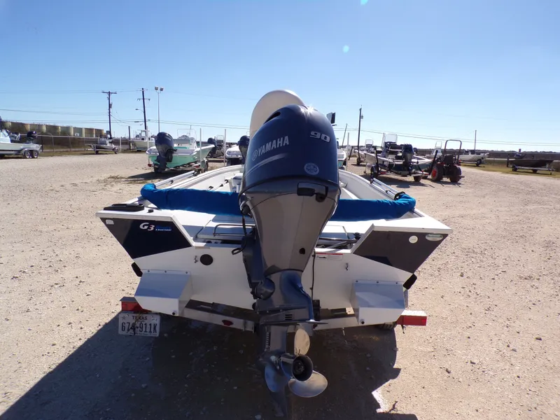 Slide: The Image of 2018 G3 Bay 18 boat with Yamaha engine in a parking lot. - 13