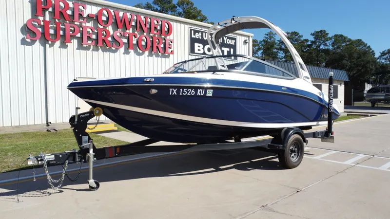 Slide: The Image of 2022 Yamaha TP1800C-XAP boat on trailer outside superstore. - 10