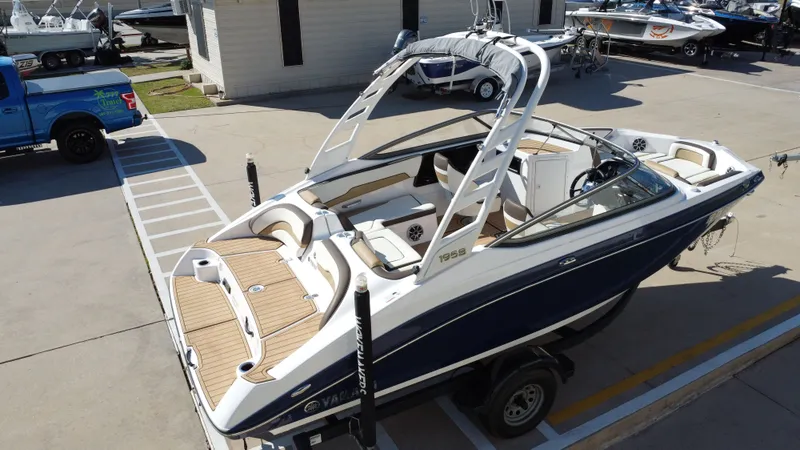 Slide: The Image of 2022 Yamaha TP1800C-XAP boat on a trailer outdoors. - 15